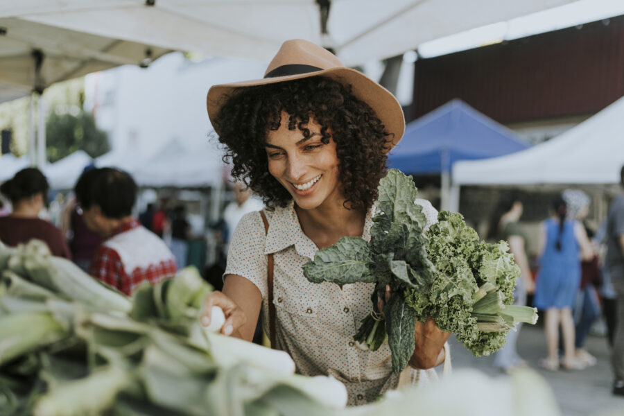 Woman buying fresh produce at farmer's market