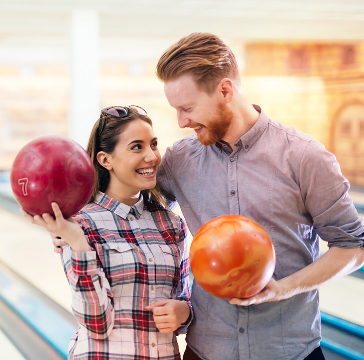 man and woman couple bowling